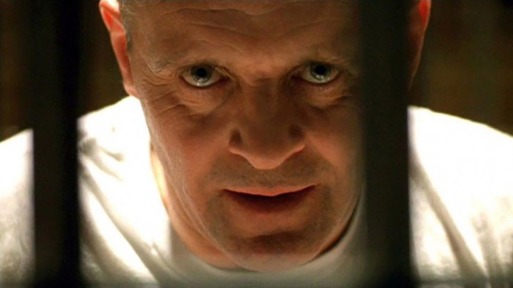 Anthony Hopkins as Hannibal Lecter looking intently at the camera in the film The Silence of the Lambs